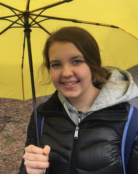 Girl smiling with umbrella