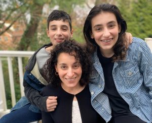 mom and two children, with olive skin and black hair